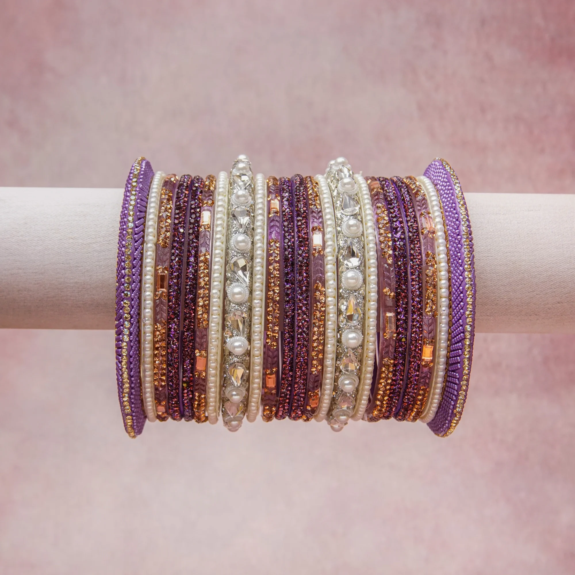 A grounding Amethyst Violet forms the heart of the set, while touches of Pearl Cream, Clear Crystal, Rose Gold, Lavender add charm.

A thoughtful composition of Glass, Rhinestones, Faux Pearls, Metallic Thread, Metal Alloy, designed to feel complete without being heavy.
Each element layers seamlessly, creating a look that is refined, wearable and quietly striking.